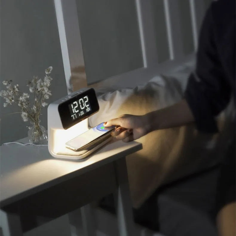White 3-in-1 bedside table lamp with wireless charging pad, LCD screen, and touch dimmer.
