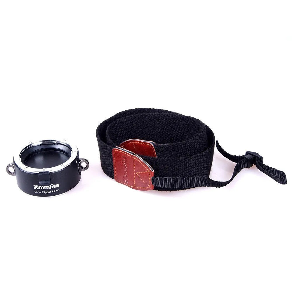 Aluminium camera lens flipper holder with cotton shoulder strap for Canon, Nikon, or Sony cameras.