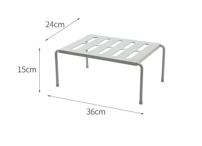 White telescopic plastic kitchen storage rack at adjustable height