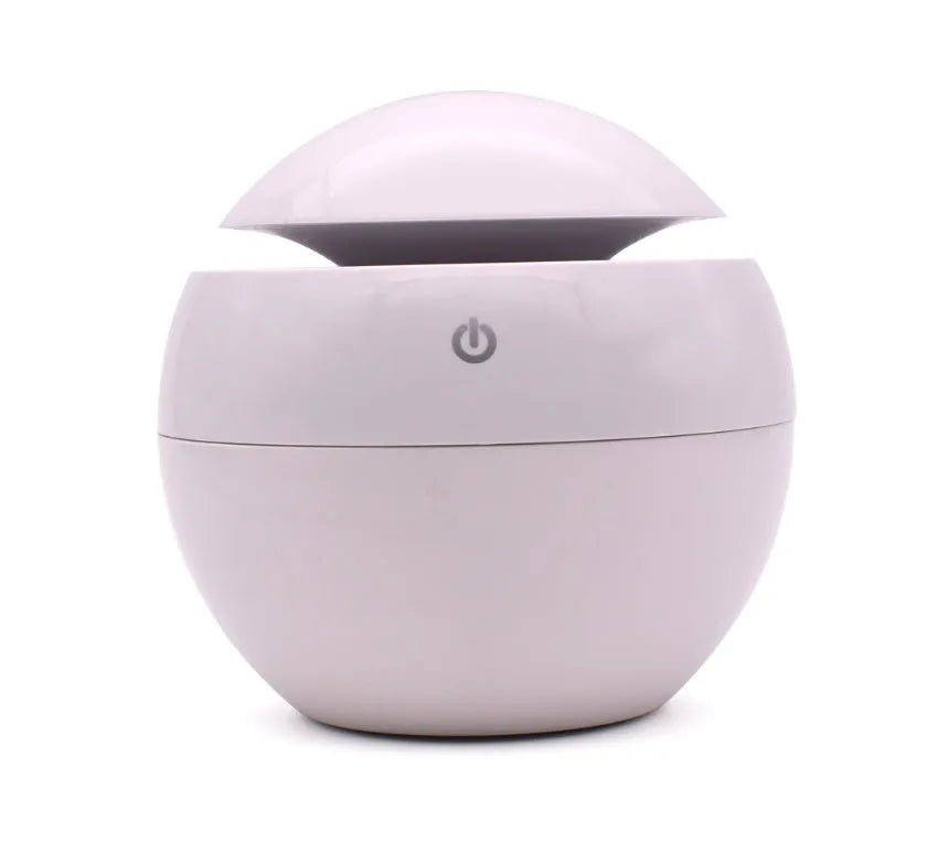 USB ultrasonic atomizer with colourful light and 130ml water tank in white colour option on a wooden desk