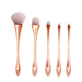 Small waist makeup brush set with nylon bristles and plastic handles in rose gold colour