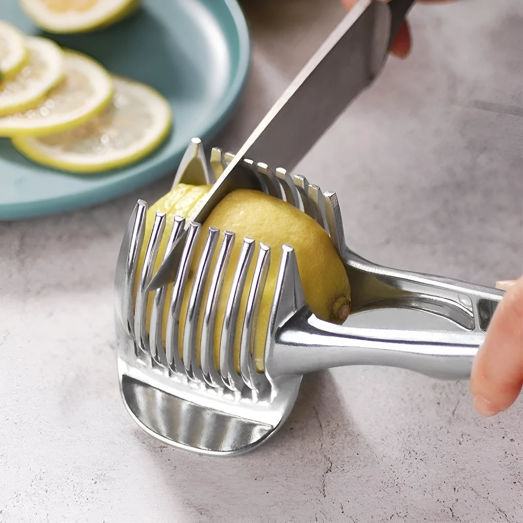 Silver plastic foldable lemon slicer kitchen gadget shown cutting citrus fruit