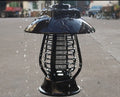 White and purple solar-powered mosquito repellent lamp for outdoor garden use.