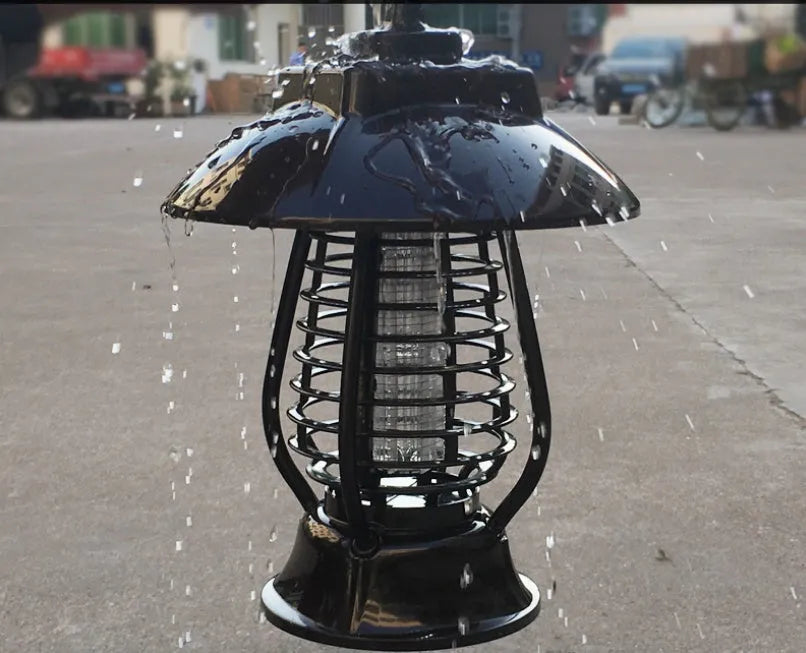 White and purple solar-powered mosquito repellent lamp for outdoor garden use.