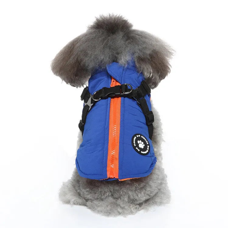 Polyester dog jacket with chest strap fastening and quilted padding in blue.