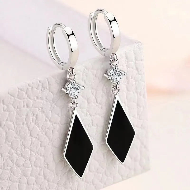 Silver geometric diamond-shaped clip earrings with vintage finish
