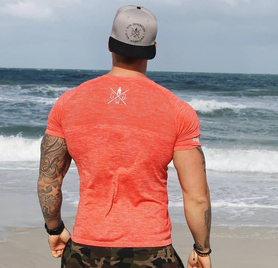 Men's short sleeve polyester workout top in orange colour for gym training