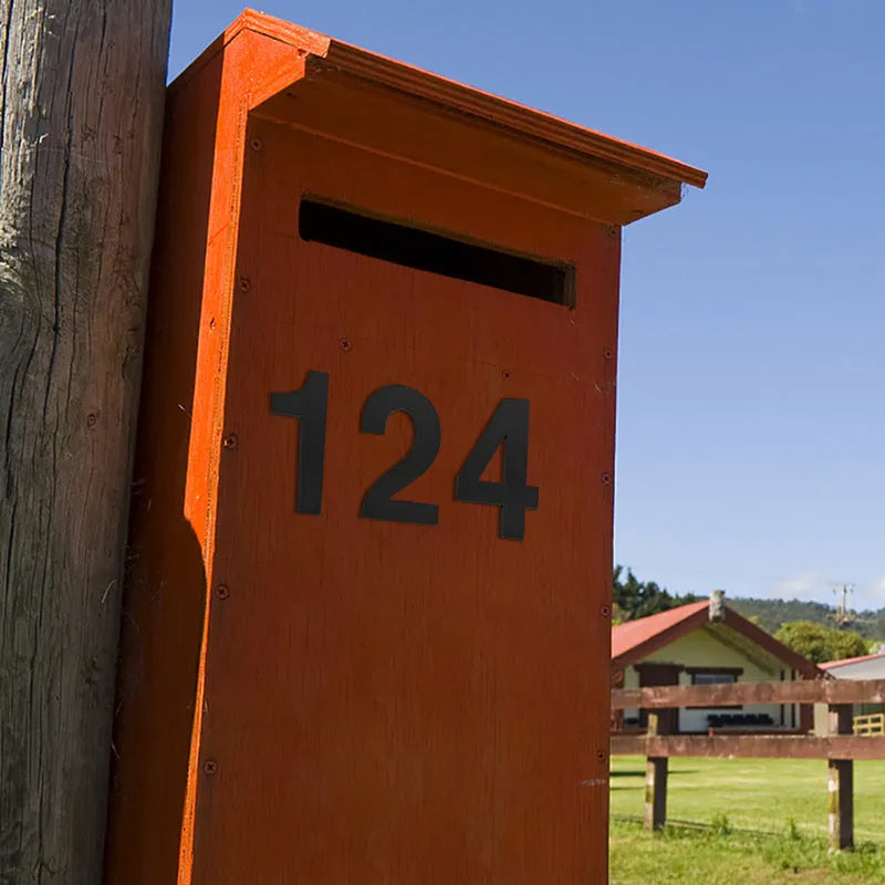 Black stainless steel sticky house numbers showing 7.5cm characters including letters and numbers