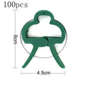 Green plastic and zinc plant fixing clips for tomatoes and climbing vines, showing large and small sizes