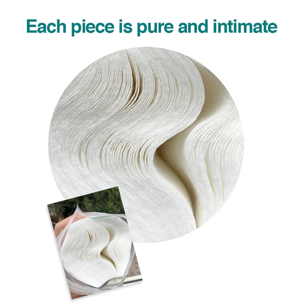 Pile of white disposable mask inner pads made of spunlaced viscose nonwoven fabric, 120x90mm size