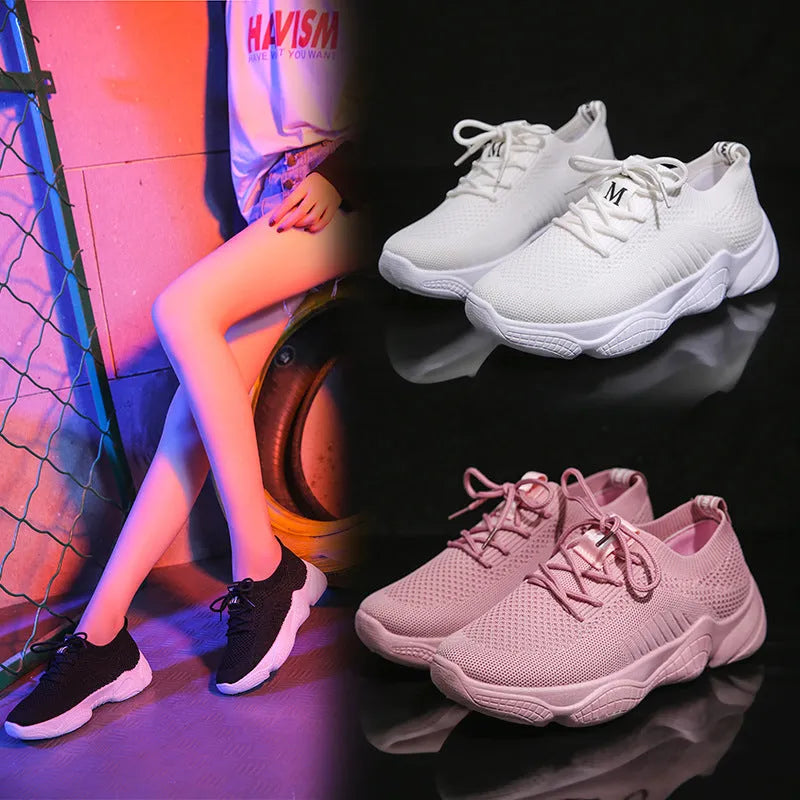 White thick-soled women's casual shoes with woven upper and front strap.