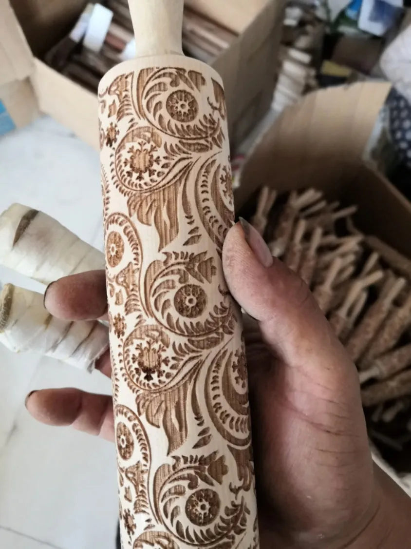 45cm long wooden rolling pin with embossed Christmas patterns like reindeer and snowflakes for baking.