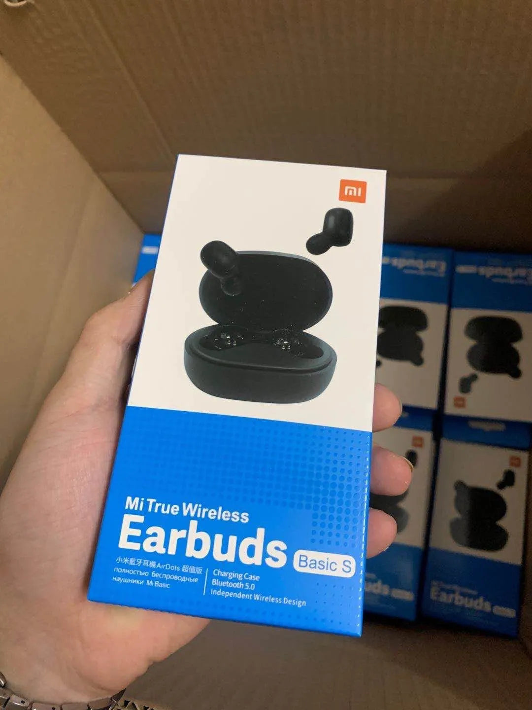 Redmi AirDots 2 black true wireless earbuds and charging case on a white background.