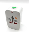 Compact universal travel plug converter adapter for multi-country mobile phone charging.