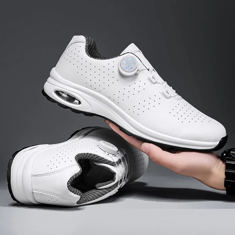 Low top black and white mesh casual shoes with cross shoulder straps and a composite sole.