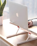 White Whale Race adjustable laptop stand with cooling radiator base for Apple MacBook.