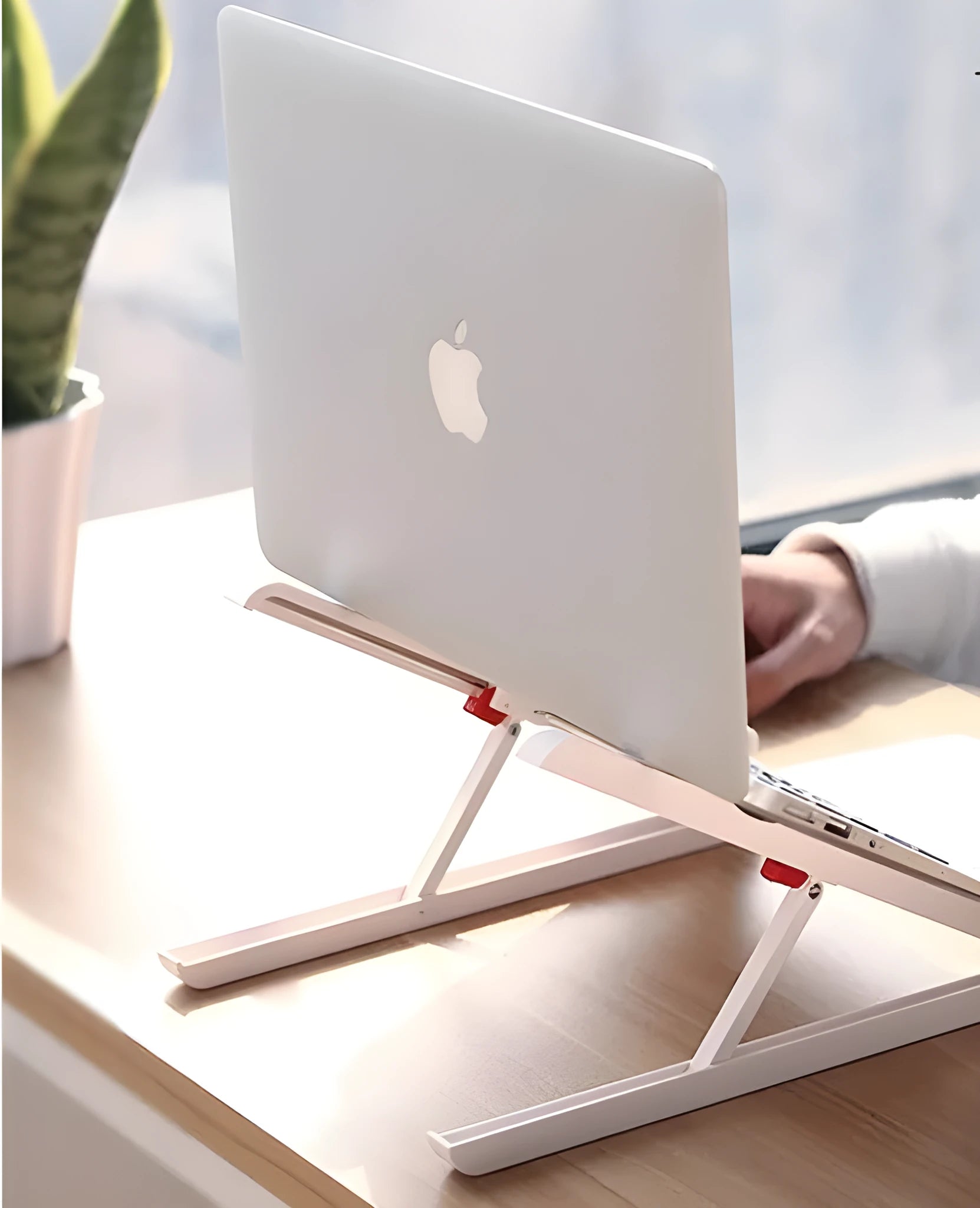 White Whale Race adjustable laptop stand with cooling radiator base for Apple MacBook.