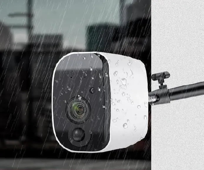 Solar powered wireless surveillance camera with 1080P lens and PIR motion sensor mounted outdoors