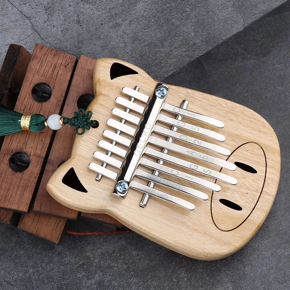 Camphorwood Mini K8 keyboard percussion instrument with five C sounds, 11.5 x 9 x 3 cm, natural wood colour.