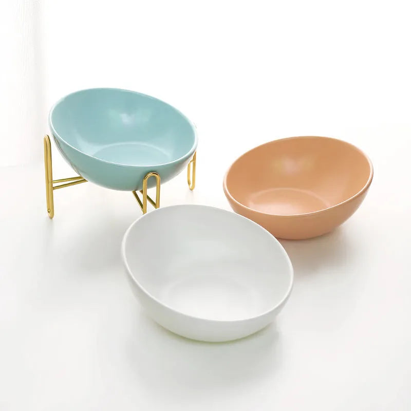 Ceramic pet bowl in blue with non-slip shelf, size M 600ml, on a wooden floor