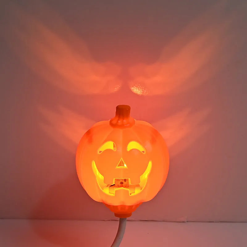 Plastic pumpkin lamp with USB power cable showing yellow or purple light options