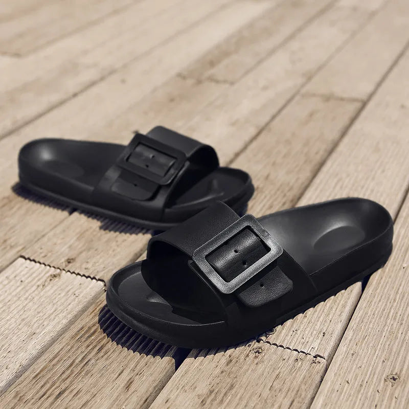 Women's grey blue flip-flop slippers with a soft EVA sole and a silver single buckle.