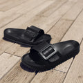 Women's grey blue flip-flop slippers with a soft EVA sole and a silver single buckle.