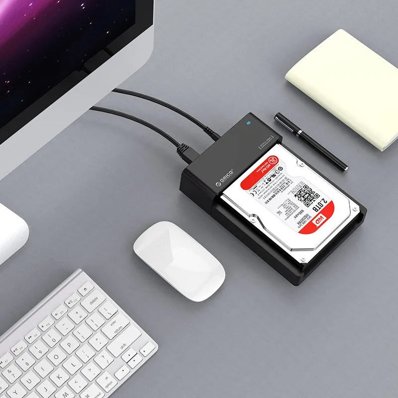 Black universal SATA hard disk enclosure for 2.5 inch and 3.5 inch drives with USB cable