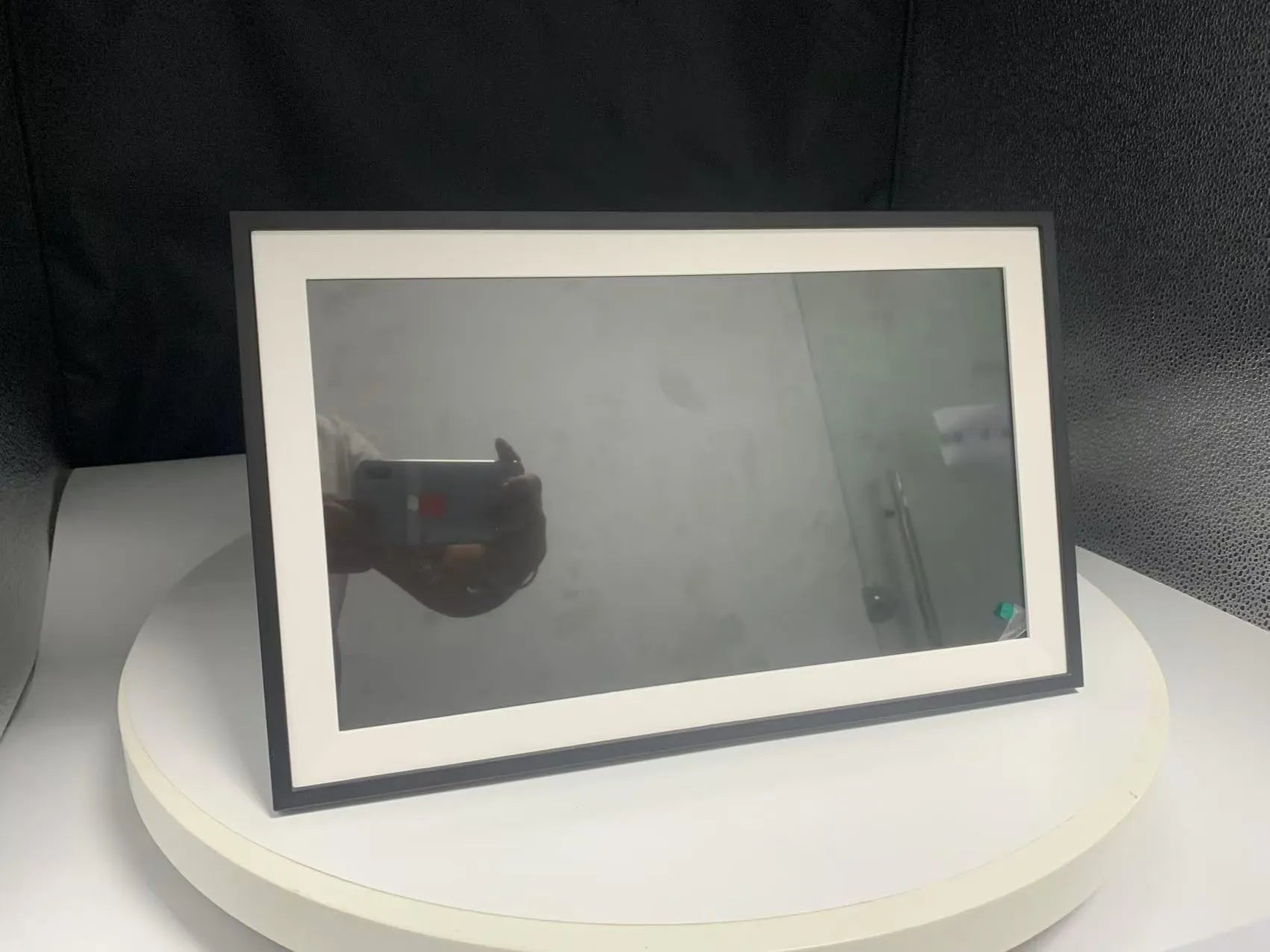 White 15.6-inch smart digital photo frame with mobile app control on tabletop