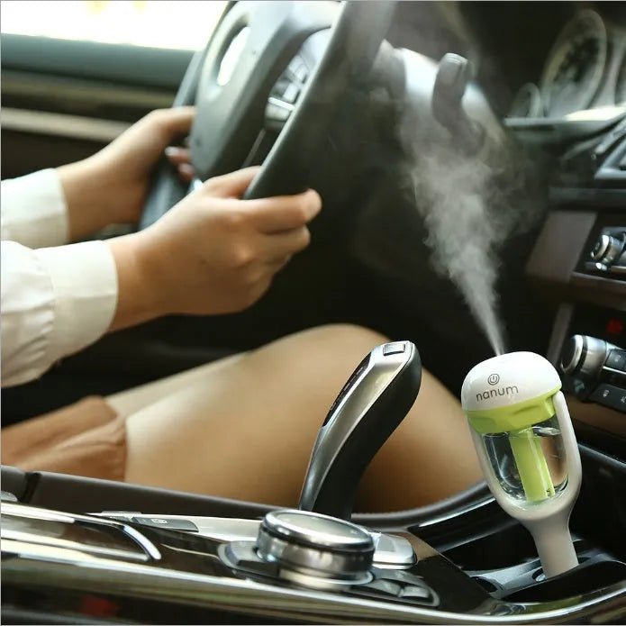 Portable car humidifier with essential oil diffuser function showing compact design for vehicle use