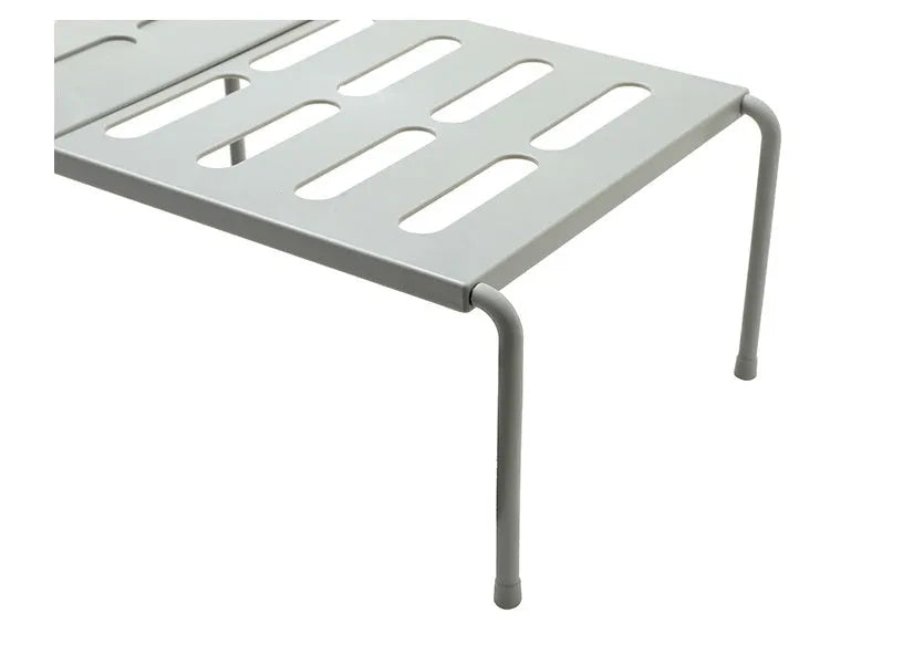 White telescopic plastic kitchen storage rack at adjustable height