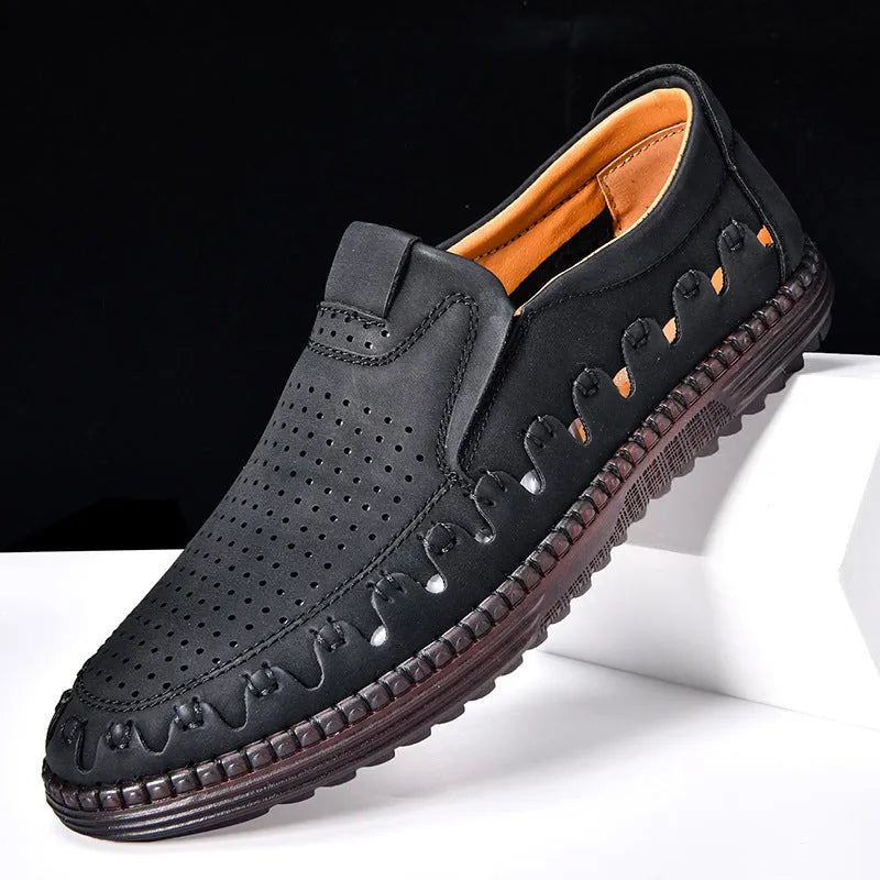 Men's brown casual slip-on shoes with round toe, low top, and sleeve entry design on a plain background.
