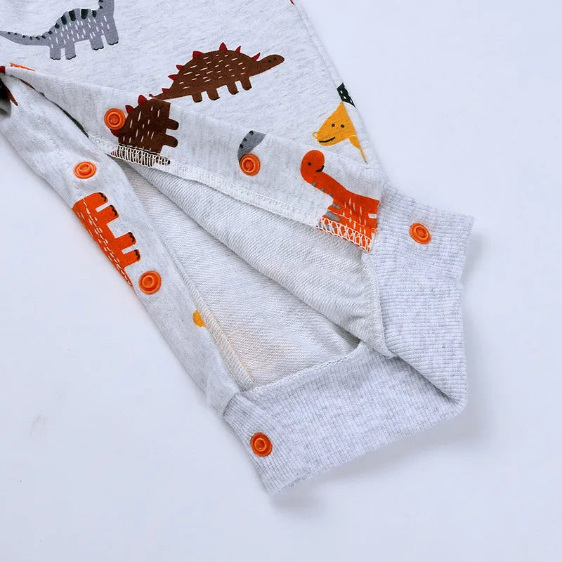 Dinosaur baby bodysuit long sleeve hooded cotton romper in grey, blue, or pink, sizes 66-90 yards