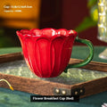 Ceramic breakfast cup with pastoral pattern, showing red and purple colour options.