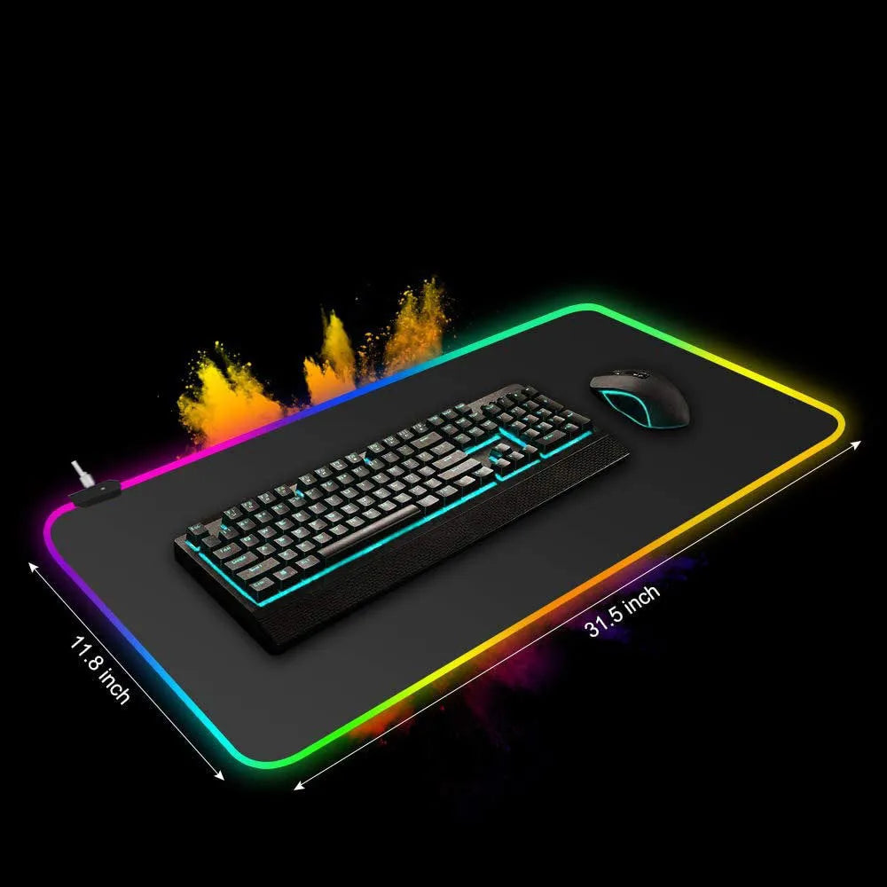 Symphony RGB luminous oversized mouse pad with USB cable on a desk, showing illuminated pattern and anti-slip rubber base.
