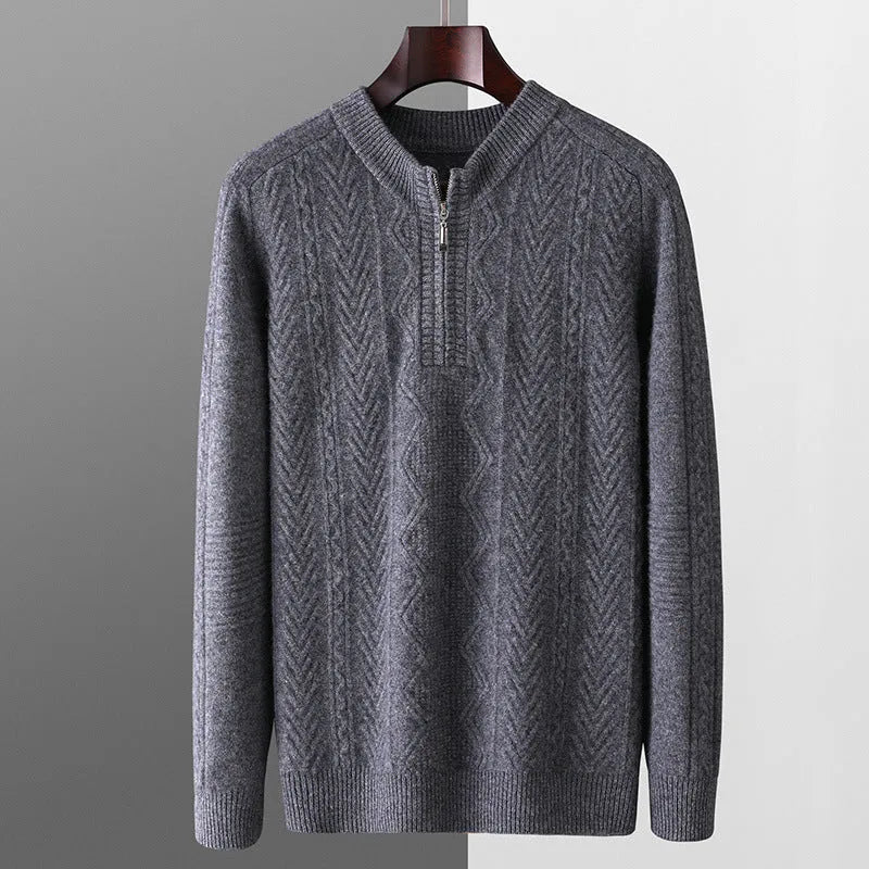 Man wearing a grey pure wool half-zip sweater with a diamond lattice pattern.