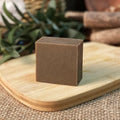 A single 72g bar of nine grass cold process shampoo soap on a plain background.