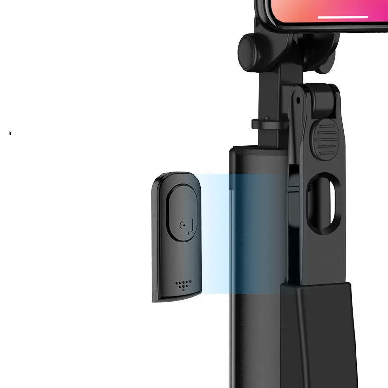 Extended black aluminium Bluetooth selfie stick with tripod legs and remote control for mobile phone.