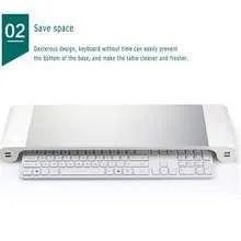 Silver and black computer monitor stand with USB ports on the front and a keyboard shelf underneath