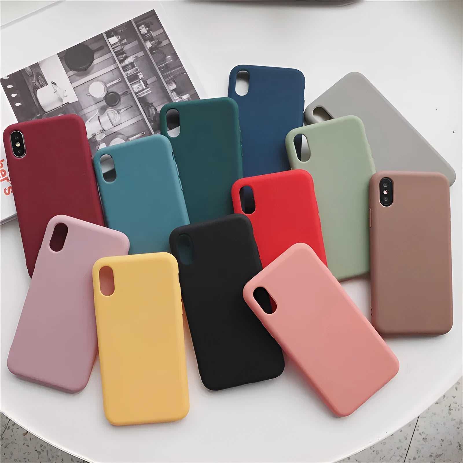 Flexible silicone phone case for iPhone in various colours including wine red and rose gold.