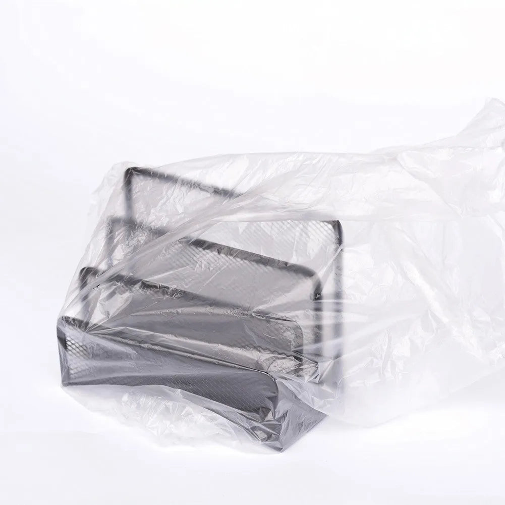 Three tier metal mesh desk organizer with iron frame storing papers and letters on a wooden desktop