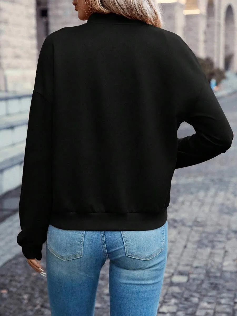 Black women's casual zip-up jacket with long sleeves and faux pockets