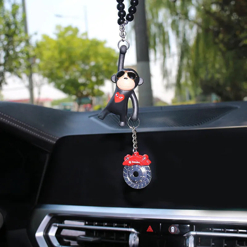 Cartoon monkey wearing sunglasses rearview mirror pendant on a bead necklace.