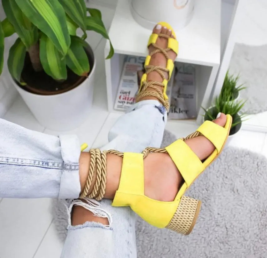 Women's beige suede sandals with fish mouth toe, front strap, ankle strap, and a thick middle heel.