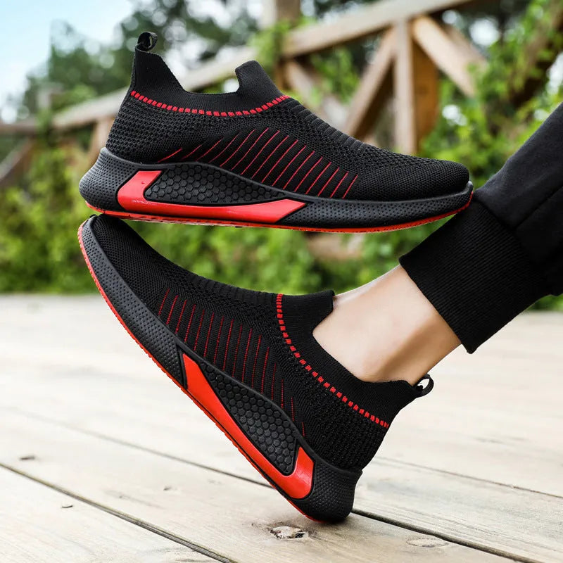 Men's mesh slip-on sneakers with striped design and breathable flyknit upper in black colour