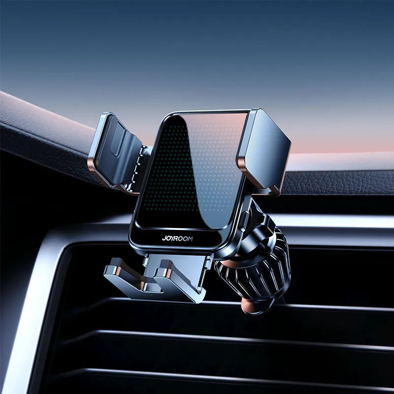 Black automatic wireless car charging bracket mounted on a car air vent, showing a phone placed on the charger.