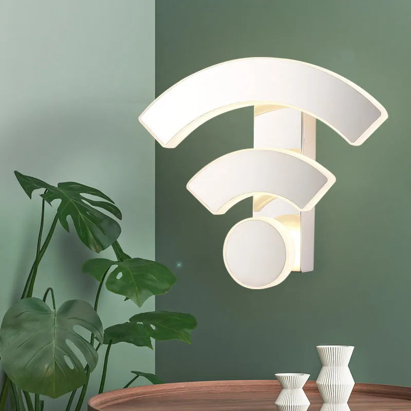 White acrylic WIFI-shaped LED wall light with warm white light on a beige wall