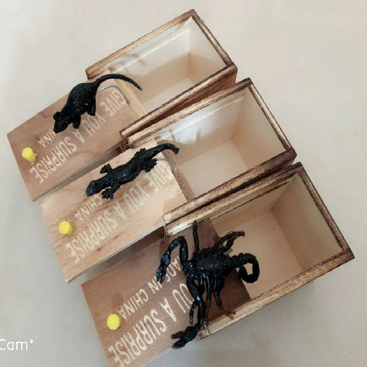 Wooden prank scare box measuring 9.1cm with a random jumping animal surprise inside