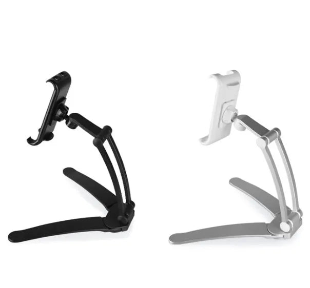 Silver aluminium alloy desktop stand holding a tablet at an angle, with adjustable clips and a white mounting base.