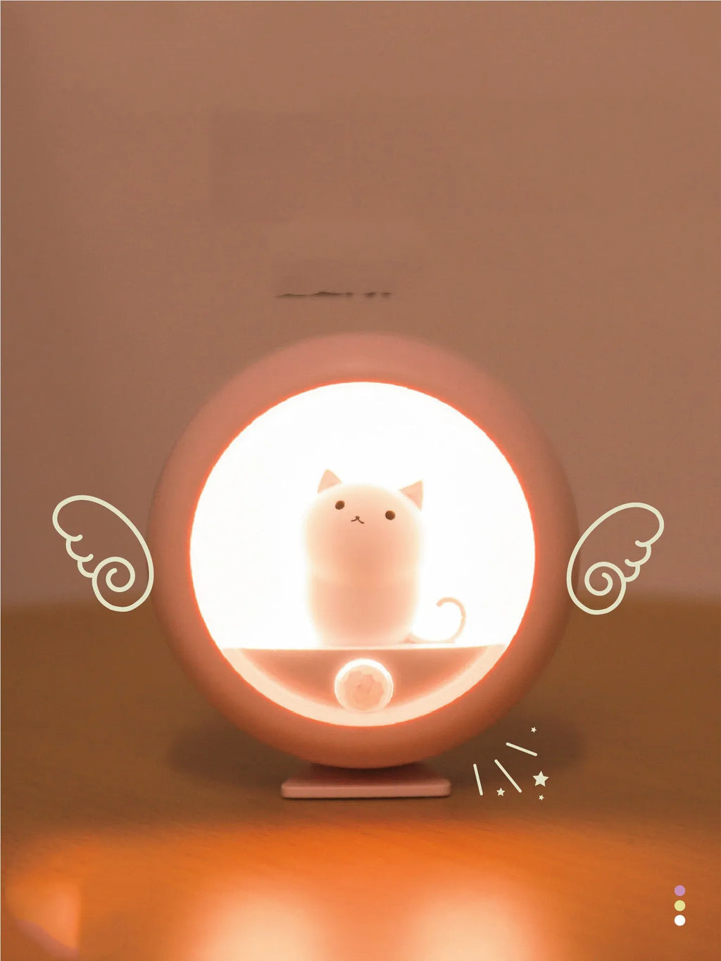 Portable bedside sleep lamp showing orange, pink and white colour options with projection feature